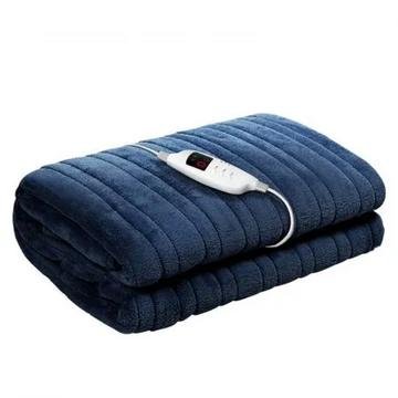 Navy coral fleece electric throw blanket draped on a couch